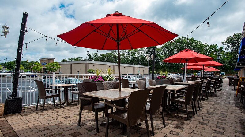 Outdoor seating area with tables with umbrellas